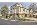 Charming townhouse with attached garages, enhanced by mature trees and a well-kept front yard at 1630 Egret Way, Superior, CO 80027