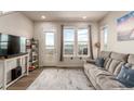 Bright living room with a view, featuring a comfortable couch and neutral decor at 2641 Channel Dr, Highlands Ranch, CO 80129