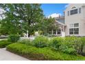 Landscaped front yard featuring a white picket fence and mature trees at 4945 Prebles Pl, Broomfield, CO 80023