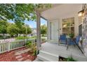 Cozy front porch with comfortable seating, perfect for relaxing and enjoying the neighborhood view at 4945 Prebles Pl, Broomfield, CO 80023