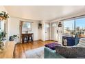 Living area shows a view of the front door and wood floors at 4330 Bruce Randolph Ave, Denver, CO 80207