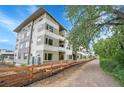 Beautiful condo complex with lush landscaping and walking path, offering a serene outdoor environment at 1304 Snowberry # 204, Louisville, CO 80027