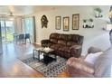 Inviting living room with wood floors, cozy furniture, and natural light, perfect for relaxation and entertaining at 1286 Finch Ave, Brighton, CO 80601