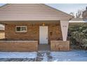 Inviting front porch with brick accents, neutral paint and visible house number at 1330 E 90Th Ave, Thornton, CO 80229