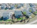 Aerial view of a home with a backyard pergola in a quiet neighborhood at 7665 Grady Cir, Castle Rock, CO 80108