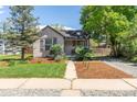 Inviting single-story home with a well-manicured lawn and charming curb appeal at 4712 Perry St, Denver, CO 80212