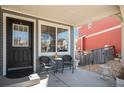 Charming front porch with seating area offers an inviting entrance to the home at 1698 Odyssey Ct, Castle Rock, CO 80109