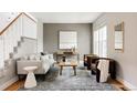 Bright living room with modern furnishings, neutral color palette, and stylish decor for a cozy atmosphere at 8122 E 6Th Pl, Denver, CO 80230