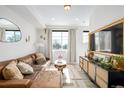 Comfortable living room with a stylish console table and plenty of natural light at 4925 W 10Th Ave # 111, Denver, CO 80204