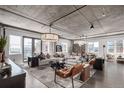 Spacious living room boasts an open layout, modern lighting, and floor to ceiling windows at 1735 19Th St # 6D, Denver, CO 80202