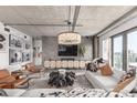 Stylish living room with modern decor, textured accent wall and contemporary lighting at 1735 19Th St # 6D, Denver, CO 80202