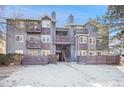 Attractive condo complex featuring multiple levels, private balconies, and well-kept grounds at 7891 Allison Way # 201, Arvada, CO 80005