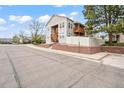 A lovely condo building showcases its two-story layout with a balcony, complemented by a brick foundation at 9677 W Chatfield Ave # E, Littleton, CO 80128
