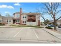 A condo building with a balcony and ample parking promises a convenient and comfortable living space at 9677 W Chatfield Ave # E, Littleton, CO 80128