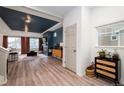 Stylish living room featuring hardwood floors, a modern fireplace, and bright, open layout at 56 Magnolia Ct, Erie, CO 80516