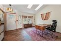 Bright office with wood floors, a modern desk, and a stylish window offers a versatile workspace at 3593 S Gibralter Cir, Aurora, CO 80013