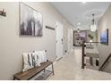 Inviting hallway with neutral tones, decorative art, and access to multiple rooms creating a warm atmosphere at 8099 Sabino Ln, Castle Rock, CO 80108
