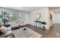 Open living space with cozy seating, modern decor, and plenty of natural light at 1926 S Yates St, Denver, CO 80219