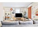 Cozy living room with neutral tones, featuring a comfortable sofa and stylish décor at 2565 Pierce St, Lakewood, CO 80214