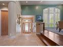 Bright foyer features tile floors, decorative lighting and an arched doorway at 392 Starmine Pl, Castle Rock, CO 80108