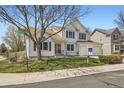 Charming two-story home with lush green lawn, mature tree, professional sign, and welcoming curb appeal at 13515 Milwaukee Ct, Thornton, CO 80241