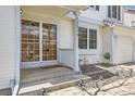 Inviting front porch with decorative glass door, welcome mat, and manicured landscaping for enhanced curb appeal at 13515 Milwaukee Ct, Thornton, CO 80241