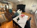 A view of the living room, dining room, and kitchen, showcasing the open concept design at 1555 California St # 609, Denver, CO 80202
