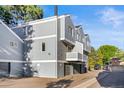 Rear view of townhome building showcasing multiple units and parking at 11622 E Cedar Ave, Aurora, CO 80012