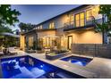 Backyard pool and patio with a sleek design, perfect for relaxation and entertaining at dusk at 2821 E Cedar Ave # 14, Denver, CO 80209