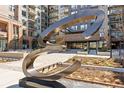 Unique sculpture in front of upscale condominium building with a modern design at 20 Wilcox # 421, Castle Rock, CO 80104