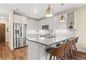 Stylish kitchen with white cabinets, stainless steel appliances, and sleek countertops at 20 Wilcox # 421, Castle Rock, CO 80104