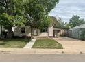 Quaint single-Gathering home with a well-maintained lawn and a covered carport providing sheltered parking at 2625 W Ellsworth Ave, Denver, CO 80219