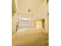Bright living room boasts high ceilings, a cozy fireplace, and expansive windows at 6407 S Dallas Ct, Englewood, CO 80111