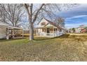 Spacious backyard featuring a covered picnic area and a detached garage, great for entertaining at 5300 Balsam St, Arvada, CO 80002