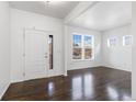 Bright and airy living room featuring hardwood floors and lots of natural light at 6284 N Genoa Way, Aurora, CO 80019