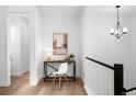 Hallway offers a workspace with a sleek desk and modern lighting at 8242 S Pierson St, Littleton, CO 80127