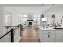 Bright living room featuring large windows, a modern fireplace, and open floor plan at 8242 S Pierson St, Littleton, CO 80127