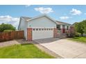 A beautiful exterior view of a well-kept home with a spacious driveway and inviting curb appeal at 13802 Jasmine St, Thornton, CO 80602
