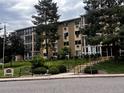 Residential building with mature trees and landscaping, offering a serene and welcoming atmosphere, near building 3022 at 3022 S Wheeling Way # 107, Aurora, CO 80014