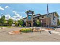 Exterior view of building with modern architecture and landscaping, situated in a well-maintained community at 3022 S Wheeling Way # 107, Aurora, CO 80014