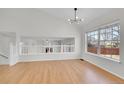 Bright living room with hardwood floors, high ceilings, stylish lighting, and lots of natural light at 5051 Yates Cir, Broomfield, CO 80020