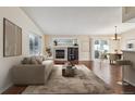 Inviting living room boasting a fireplace, wine cooler, and lots of natural light at 11565 Decatur St # 7D, Denver, CO 80234