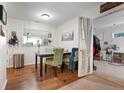 Dining area featuring hardwood floors and a window with a view at 4961 E Cornell Ave, Denver, CO 80222