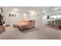 Spacious living room with plush carpeting and bright natural light at 4961 E Cornell Ave, Denver, CO 80222