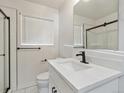Stylish bathroom with modern fixtures, a sleek vanity, and a glass-enclosed shower at 1475 S Eaton St, Lakewood, CO 80232