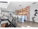 Stylish living area with a bar, exposed brick wall, and modern design elements at 1449 Wynkoop St # 601, Denver, CO 80202