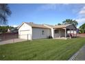 The backyard shows a lawn area, patio, and detached garage at 2685 W Asbury Ave, Denver, CO 80219