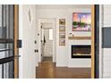 Inviting living room features a modern fireplace, stylish decor, hardwood floors, and a cozy ambiance at 2930 Oneida St, Denver, CO 80207