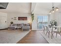 Cozy living room and dining area with modern furnishings and water view from the balcony at 6850 Xavier Cir # 5, Westminster, CO 80030