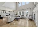Bright open-concept living room features high ceilings and lots of natural light at 12110 Bay Oaks Ct, Parker, CO 80138